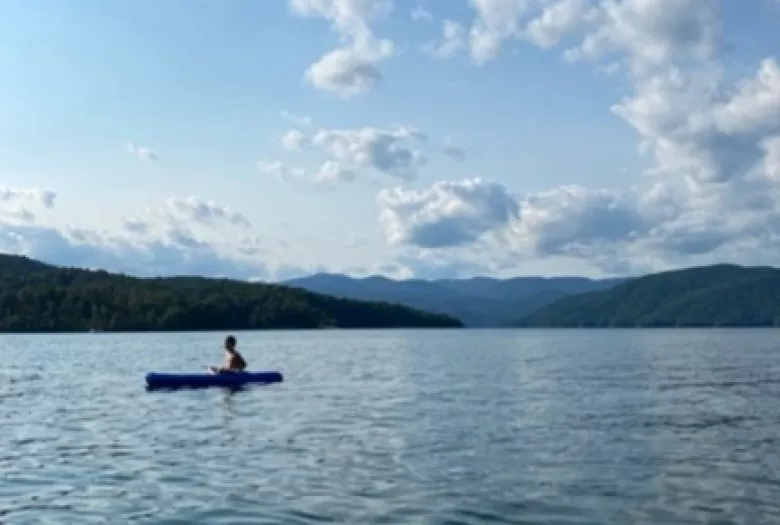 Person kayaking on a lake