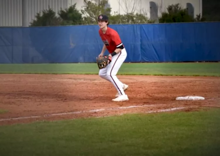 Noah playing first base in a baseball game